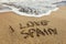 The words I Love Spain written in the sand