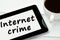 The words Internet crime on tablet pc