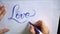 Words love story with blue ink brush calligraphy and lettering