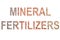 Words `MINERAL FERTILIZERS` made of mineral fertilizers background