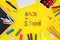 words of multi-colored plasticine back to school and black chalk board and school supplies chalk, felt-tip pens, paints