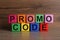 Words Promo Code made of colorful cubes with letters on wooden table