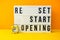 Words reset, restart and reopening text on the light box. New life, new business, new deals concept. Alarm clock. New normal