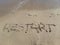 Words `Restart` written on wet sand at the sea