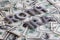 The words ROTH IRA laid with aluminium letters on the US dollar banknotes background - with selective focus