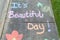 The words "It's a beautiful day" motivational phrase