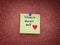 The words World heart Day on a green sticky note that is pinned to a cork board