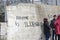 Words written by refugees and volunteers on walls at the Greek i