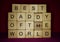 Words written on wood blocks: best daddy of the world. Happy Fathers Day Concept.