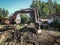 Work on the backhoe for landscaping in the Kaluga region in Russia.