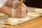 Work in bakery, making filled pies