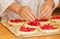 Work in bakery, making fruit filled pies