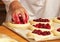 Work in bakery, making fruit filled pies