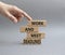 Work and deadline symbol. Concept words Work and meet deadlines on wooden blocks. Beautiful grey background. Businessman hand.