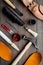 Work desk of shoemaker with instruments, wooden shoe and leather. Dark wooden background top view