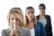 We work even if were sick. Shot of a group of businesswomen standing in a row and looking at the camera with one blowing