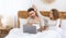 Work in evening. Busy husband in bed with laptop, wife flirts with guy