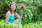 Work in the garden. woman collects radish harvest