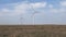 Work of the group of wind power. Wind power generator installed in the field.