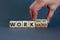 Work hard or smart symbol. Businessman turns wooden cubes and changes words `work hard` to `work smart`. Beautiful grey backgr