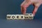 Work hard or smart symbol. Businessman turns wooden cubes and changes words `work hard` to `work smart`. Beautiful grey backgr