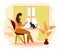 Work at home, freelance. Girl works on a smartphone near the window. A young woman sits on a chair in the house, a cat