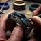 Work of jeweler, hands of person making jewelry close-up, work with jewelry close up