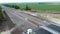 Work on laying of asphalt. Aerial photography video. The repair of the road. The view from the top