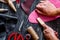 Work in leather shop on dark wooden background top view