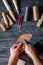 Work in leather shop on dark wooden background top view