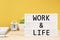 Work - Life written white lightbox. Work Life Balance concepts