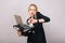 Work office busy time of blonde young woman in formal clothes with laptop, folder talking on phone on white background