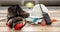 Work safety protection equipment. Industrial protective gear on wooden table, blur construction site background