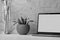 Work space with laptop with white clean screen, flower and wooden drawing figure