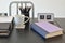 Work table with book,pencils, cup of coffee and clock