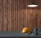 Work table of a carpenter, helmet and hammer on wooden wall back