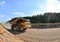 Work truck in the quarryon transportation of sand. Extraction of minerals