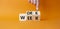 Work Week symbol. Businessman hand points at cubes with words Work Week. Beautiful orange background. Business and Work Week