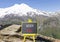 Work well symbol. Concept words Work well on beautiful black chalk blackboard. Beautiful mountain Elbrus blue sky background.