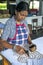 A worker applies wax to a batik at the Baba Batik factory in Matale in Sri Lanka.