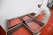 A worker arranged boxes with raw meat minced in an industrial process factory in a steel crate at a processing