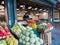 Worker arranges produce at shop in Pike Place, Seattle