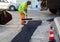 Worker on Asphalting paver machine