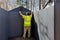 Worker assembling an together plastic vinyl shed for backyard near in the home