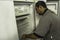 Worker on the assembly line of refrigerated chambers