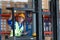 Worker in auto parts warehouse use a forklift to work to bring the box of auto parts into the storage shelf