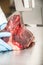 worker on band saw cut meat in a meat shop