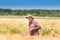 Worker in barley field