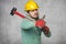 Worker with a big hammer, thumb up