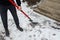 Worker breaking, cleaning the ice with a shovel